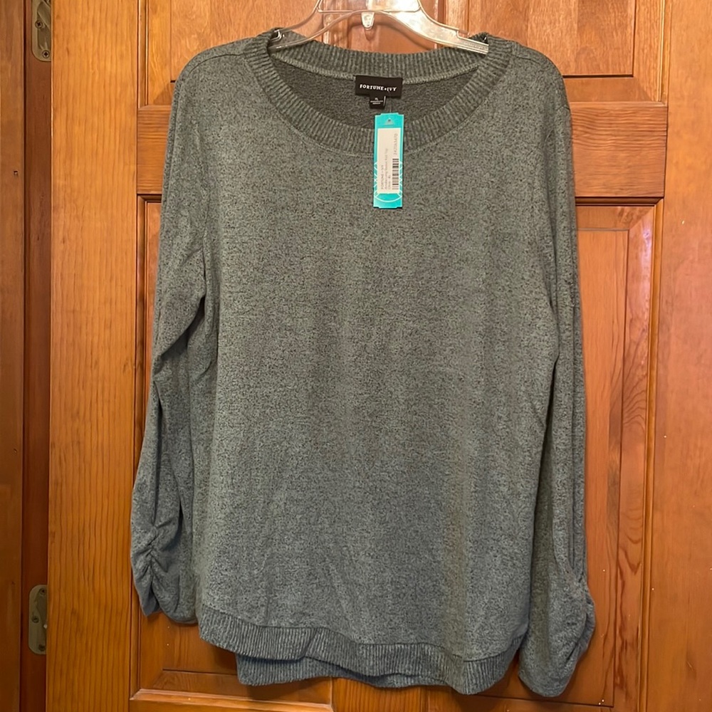 Pleated sleeve cuffs elevate this sweater to the next level!